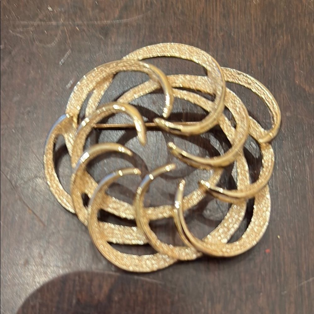 Elegant Gold Circular Brooch